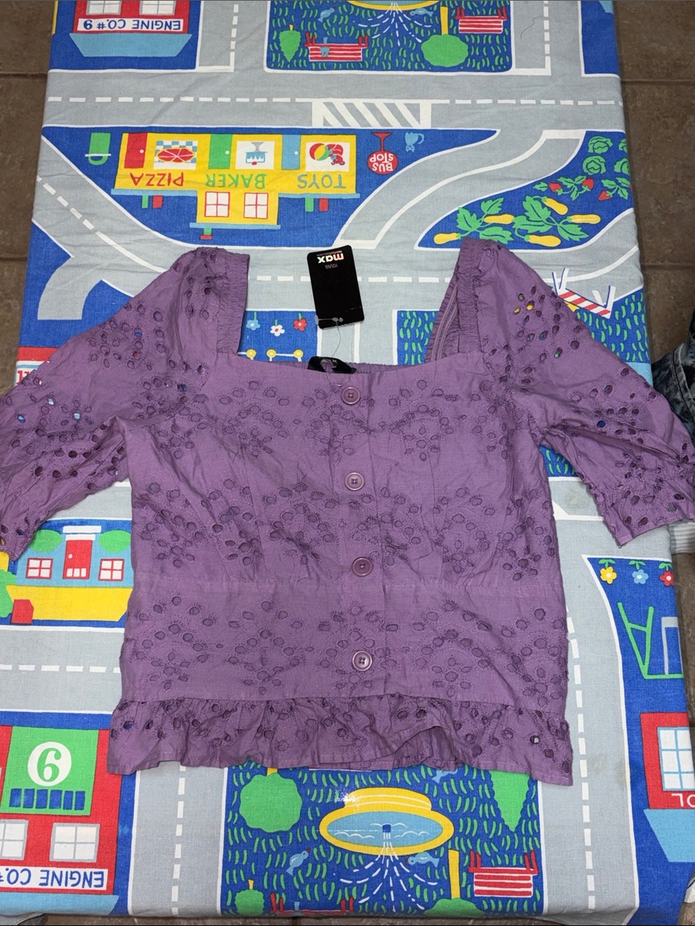 Purple short sleeve smocked eyelet blouse